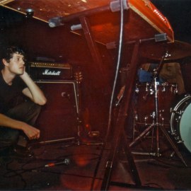 Josh taking an on-stage break at The Brickyard in Vancouver, 2002.